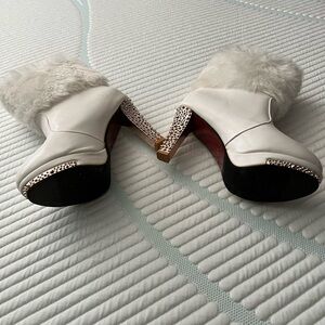 White leather with fur cuff on top. Gold studded 4”heeled boots